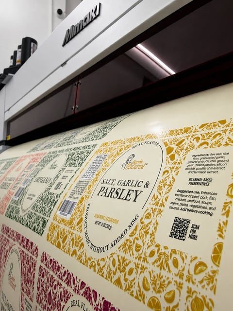 Close-up of food product packaging with Salt Garlic and Parsley label, displayed on retail shelf with store signage above