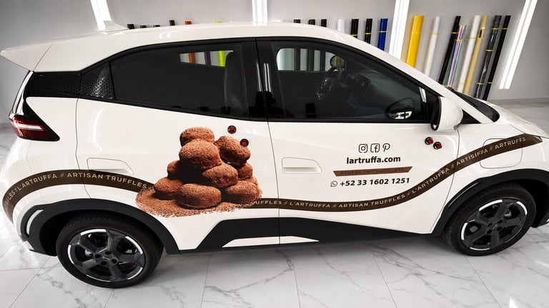 White compact SUV with teddy bear graphic on side, featuring black trim and wheels in showroom setting